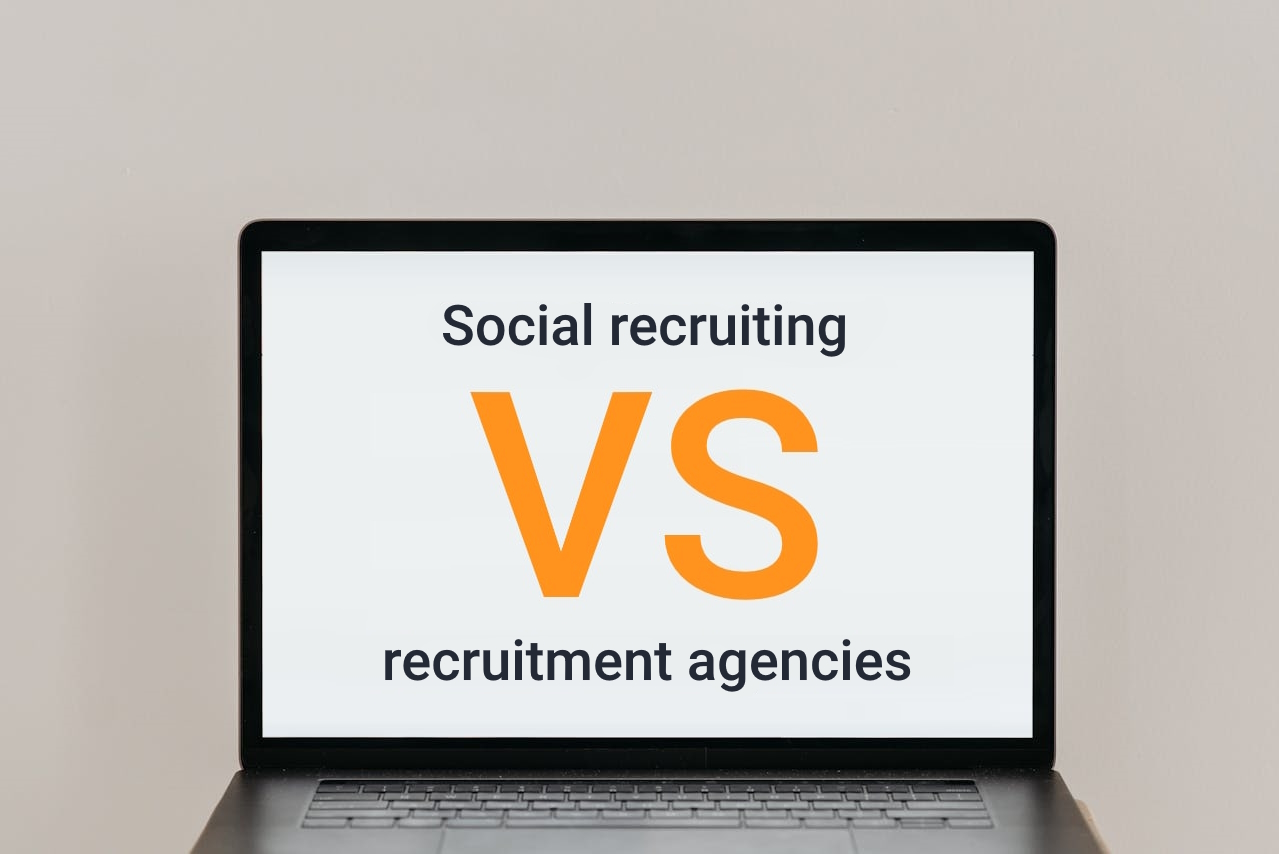 Laptop displaying 'Social Recruiting' at the top and 'Recruitment Agencies' at the bottom with a large orange 'VS' in the middle, symbolizing the comparison between the two methods as discussed in the blog post.